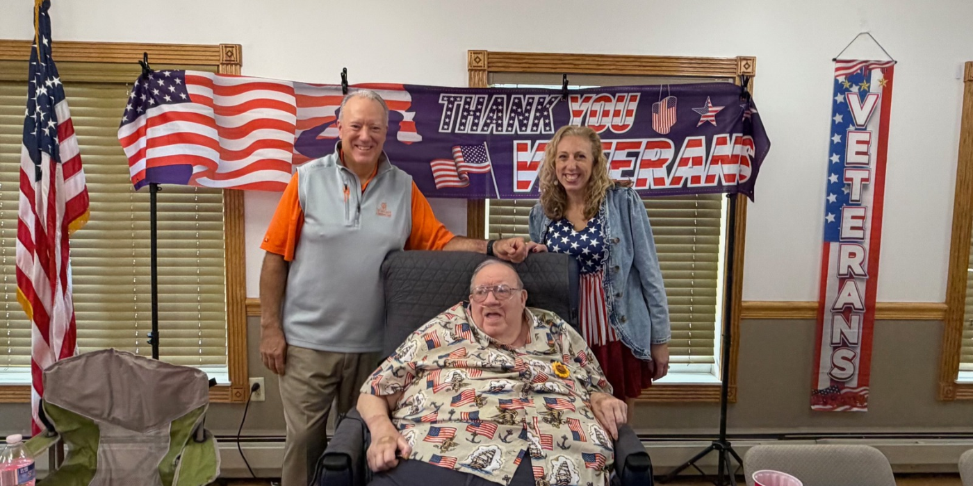 family standing around veteran