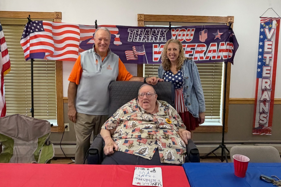 family standing around veteran