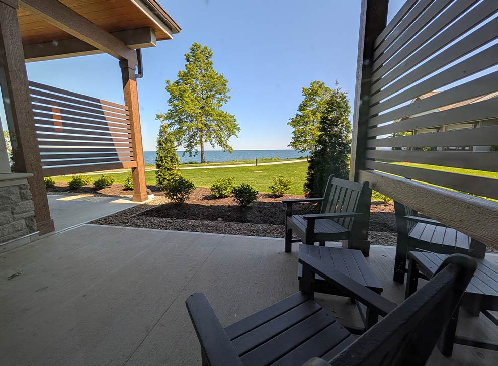 Outdoor patio seating area with lake views, designed for patients, families, and visitors